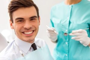 man smiling in dental office