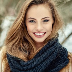 woman smiling after her teeth whitening treatment